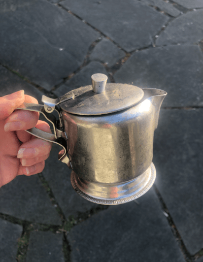 A tin tea pitcher